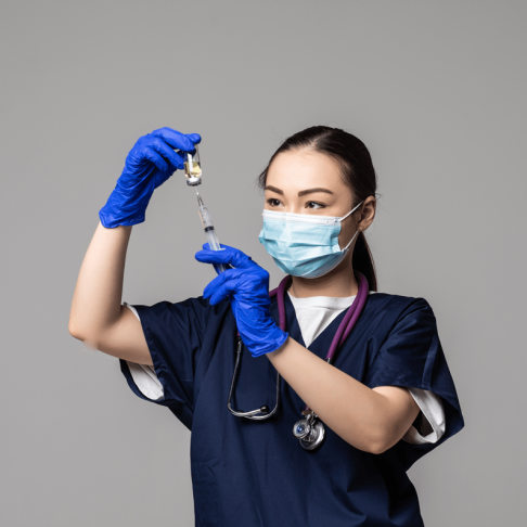 portrat-young-asian-female-doctor-drawing-covid-19-vaccine-from-vaccine-bottle